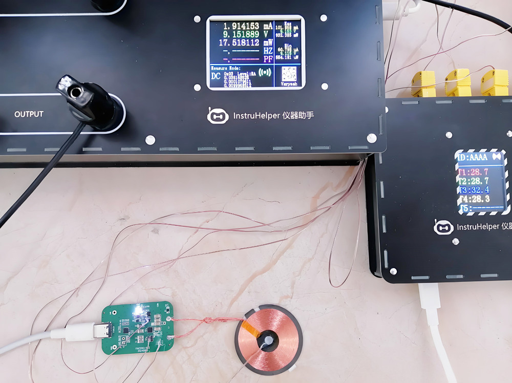 A technician testing a wireless charger in a lab