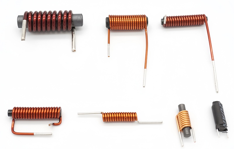 An air core coil next to a ferrite core coil